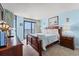 Main bedroom with king-size bed, ocean view, and wood furniture at 501 S Ocean Blvd. # 505, North Myrtle Beach, SC 29582