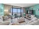 Ocean view living room with comfy sofas and coastal decor at 501 S Ocean Blvd. # 505, North Myrtle Beach, SC 29582