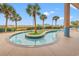Relaxing, lagoon-style pool with palm trees and ocean views at 501 S Ocean Blvd. # 505, North Myrtle Beach, SC 29582