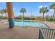 Inviting rectangular pool with ocean views and palm trees at 501 S Ocean Blvd. # 505, North Myrtle Beach, SC 29582