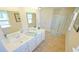Elegant bathroom with double vanity, large mirror, and walk-in shower at 511 Firouz Dr, Longs, SC 29568