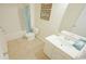 Clean bathroom with a tub, toilet, vanity, and light teal accents at 511 Firouz Dr, Longs, SC 29568