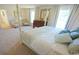 Main bedroom with a large four-poster bed and sitting area at 511 Firouz Dr, Longs, SC 29568