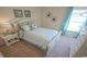 Bright bedroom featuring a white bed frame and teal accents at 511 Firouz Dr, Longs, SC 29568