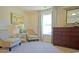 Bedroom with two armchairs, dresser, and large window at 511 Firouz Dr, Longs, SC 29568