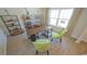 Home office with wood desk, green chairs, and built-in shelving at 511 Firouz Dr, Longs, SC 29568