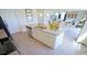 Open concept kitchen with island, white cabinets, and stainless steel appliances at 511 Firouz Dr, Longs, SC 29568