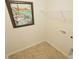 Laundry room with overhead shelving and tile flooring at 511 Firouz Dr, Longs, SC 29568