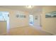 Upstairs hallway with light walls and carpet flooring at 511 Firouz Dr, Longs, SC 29568
