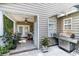 Covered patio with an outdoor kitchen, a stainless steel grill, and various plants at 512 Goff Creek Ct., Myrtle Beach, SC 29579