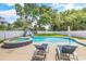 Inviting backyard oasis featuring a kidney-shaped pool, spa, and waterslide at 5907 Haskell Circle, Myrtle Beach, SC 29572