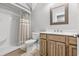 Clean bathroom with shower, toilet and wood vanity at 5907 Haskell Circle, Myrtle Beach, SC 29572