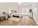 Bedroom with hardwood floors, a dresser and french doors at 5907 Haskell Circle, Myrtle Beach, SC 29572