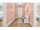 Bright entryway with light pink walls and a white bench at 5907 Haskell Circle, Myrtle Beach, SC 29572