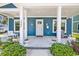 Inviting front porch with white columns and seating at 5907 Haskell Circle, Myrtle Beach, SC 29572