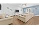 Living area with sectional sofa, hardwood floors, and coastal decor at 5907 Haskell Circle, Myrtle Beach, SC 29572