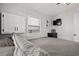 Serene bedroom with gray comforter, wall-mounted TV, and window at 6001-1235 S Kings Highway, Myrtle Beach, SC 29575