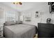 Comfortable bedroom with a gray comforter and black dresser at 6001-1235 S Kings Highway, Myrtle Beach, SC 29575