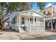 Charming white cottage with front porch and small yard at 6001-1235 S Kings Highway, Myrtle Beach, SC 29575