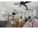 Open concept kitchen and living area with stainless steel appliances and ceiling fans at 6001-1235 S Kings Highway, Myrtle Beach, SC 29575