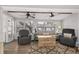 Cozy living room featuring a comfy sofa, two armchairs, and a rustic coffee table at 6001-1235 S Kings Highway, Myrtle Beach, SC 29575