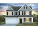 Two-story house with gray siding, white trim, and a two-car garage at 6048 Forest Dell Ct, Myrtle Beach, SC 29579