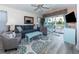 Living room features a comfy couch and access to balcony at 638 Waterway Village Blvd. # 16G, Myrtle Beach, SC 29579