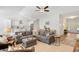 Open living area with gray sectional sofa, hardwood floors, and kitchen views at 735 Tyson Dr., Pawleys Island, SC 29585