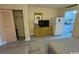 Condo bedroom with two double beds, dresser, closet, and kitchenette at 7500 N Ocean Blvd. # 6145, Myrtle Beach, SC 29572