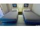 Two double beds in a condo bedroom with light wood flooring at 7500 N Ocean Blvd. # 6145, Myrtle Beach, SC 29572