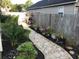Stone pathway meanders through a lush backyard garden at 804 Brenda Pl., Myrtle Beach, SC 29577