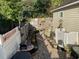 Landscaped backyard with stone pathway, grill, and abundant flowers at 804 Brenda Pl., Myrtle Beach, SC 29577