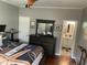Bedroom with ensuite bathroom and dresser at 804 Brenda Pl., Myrtle Beach, SC 29577