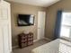 Bedroom with mounted TV and dresser at 804 Brenda Pl., Myrtle Beach, SC 29577