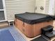 Hot tub with cover and steps on patio at 804 Brenda Pl., Myrtle Beach, SC 29577