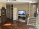 Living room with fireplace, built-in shelving, and hardwood floors at 804 Brenda Pl., Myrtle Beach, SC 29577