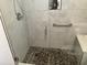Walk-in shower with pebble floor and built-in shelves at 804 Brenda Pl., Myrtle Beach, SC 29577