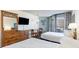 Condo bedroom with two beds, dresser, and ocean view at 9550 Shore Dr. # 722, Myrtle Beach, SC 29572