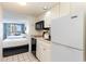 Condo kitchen with appliances and view into bedroom at 9550 Shore Dr. # 722, Myrtle Beach, SC 29572