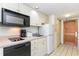 Small condo kitchen with microwave, stovetop, and refrigerator at 9550 Shore Dr. # 722, Myrtle Beach, SC 29572