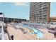 Large lazy river pool with many lounge chairs at 9550 Shore Dr. # 722, Myrtle Beach, SC 29572