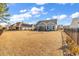 A spacious backyard with a fence, a small tree, and a view of the house at 980 Desert Wheatgrass Dr., Myrtle Beach, SC 29579