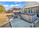 Backyard with a hot tub and patio furniture next to a house at 980 Desert Wheatgrass Dr., Myrtle Beach, SC 29579