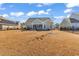 Backyard with a brown lawn, fence, and an enclosed porch at 980 Desert Wheatgrass Dr., Myrtle Beach, SC 29579
