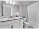 Well-lit bathroom with a marble countertop vanity, a bathtub, and a toilet at 980 Desert Wheatgrass Dr., Myrtle Beach, SC 29579
