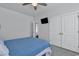 Neutral bedroom with a ceiling fan, and a built-in tv. The room also includes a closet with double doors at 980 Desert Wheatgrass Dr., Myrtle Beach, SC 29579