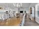Open-concept dining room with chandelier and adjacent kitchen and living area at 980 Desert Wheatgrass Dr., Myrtle Beach, SC 29579
