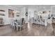 Elegant dining area connected to the kitchen, featuring stylish chairs, chandelier, and open floor plan at 980 Desert Wheatgrass Dr., Myrtle Beach, SC 29579