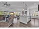 Open-concept kitchen and living area featuring hardwood floors and stainless steel appliances at 980 Desert Wheatgrass Dr., Myrtle Beach, SC 29579
