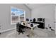 Bright office space with a large window, featuring multiple desks, chairs, and office equipment on carpet floors at 980 Desert Wheatgrass Dr., Myrtle Beach, SC 29579